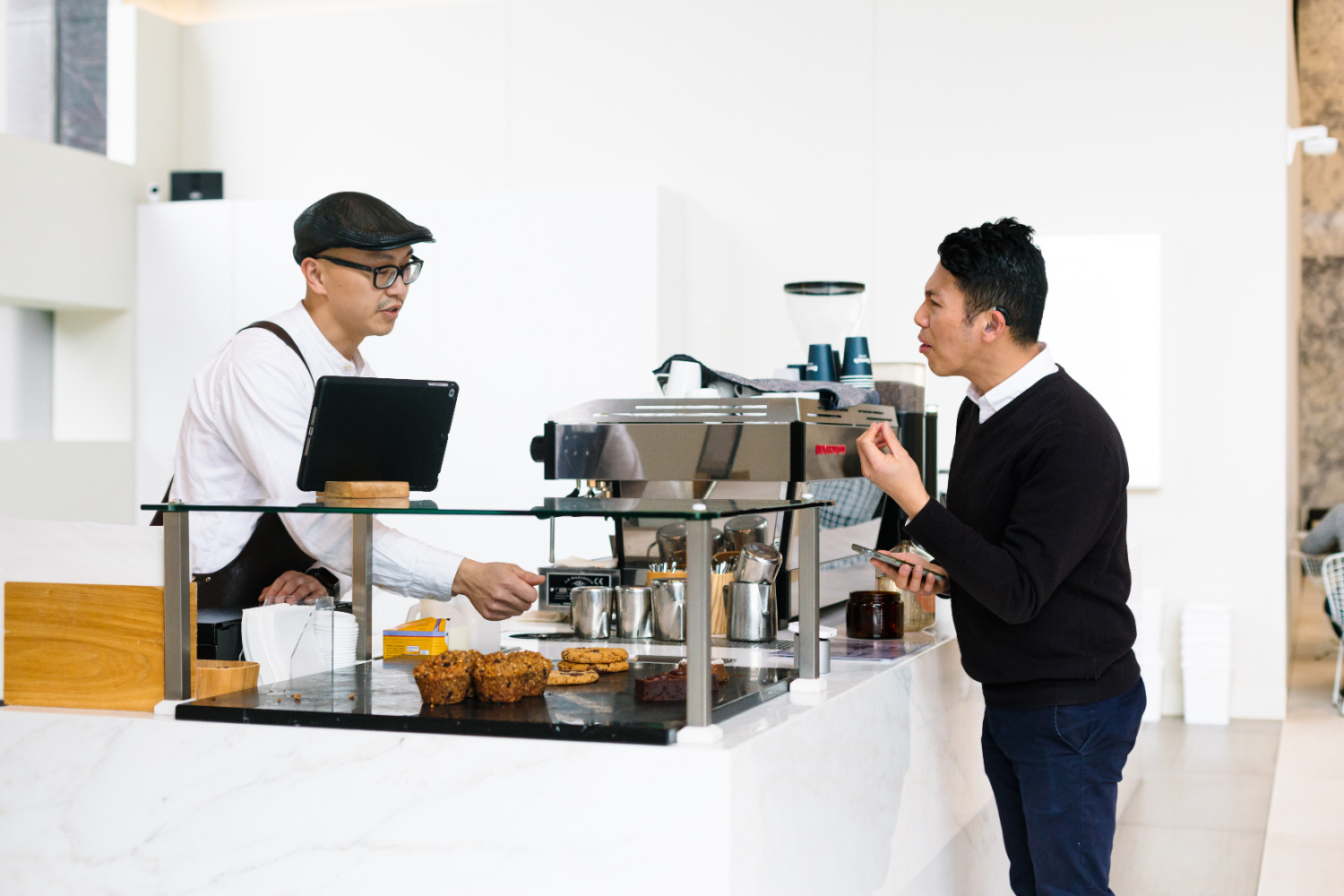 Man ordering at a cafe Man ordering at a cafe
