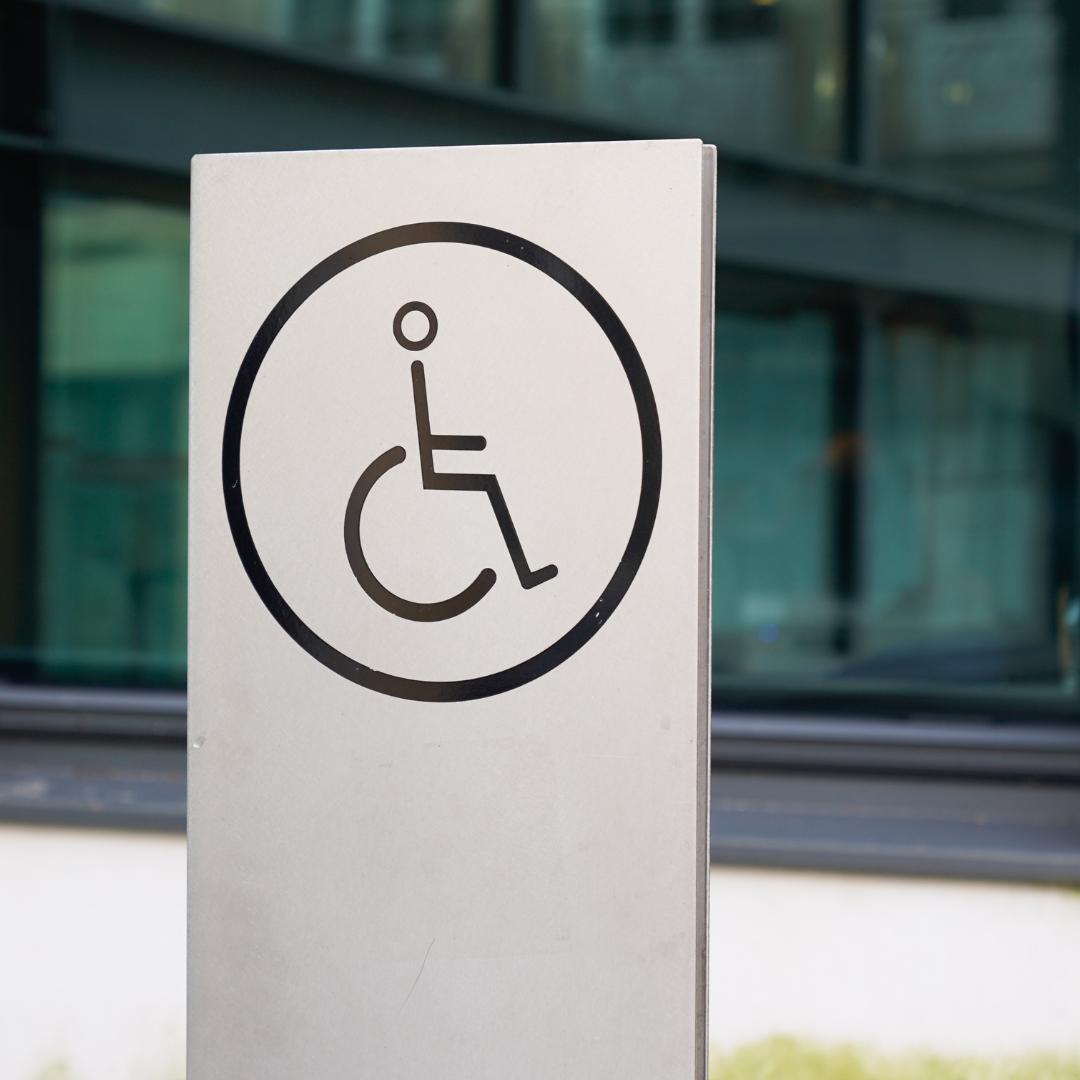 Wheelchair accessibility sign in front of a building
