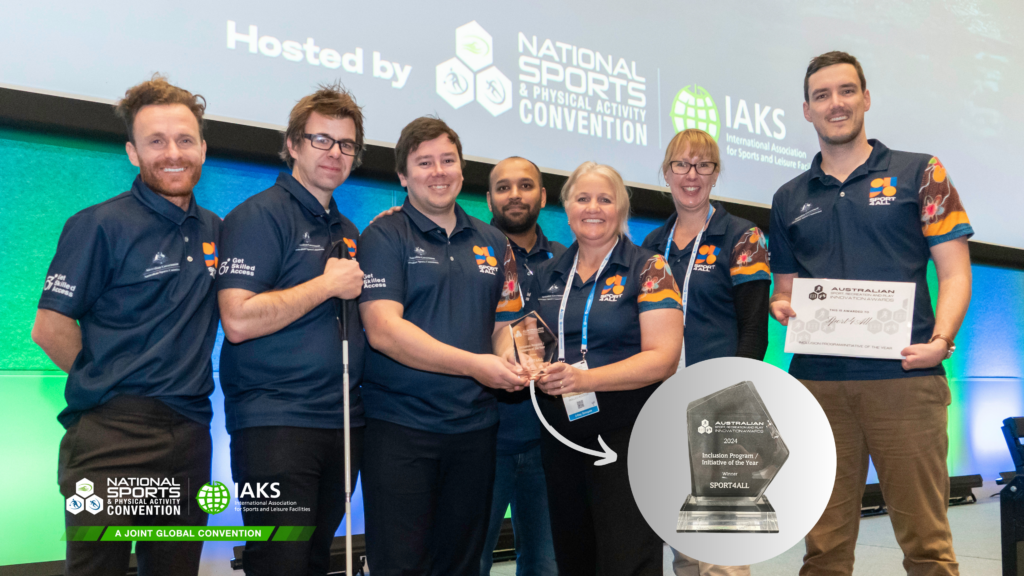 A group photo of the Sport4All team holding the Inclusion Program/Initiative of the Year Award at the National Sports Convention.