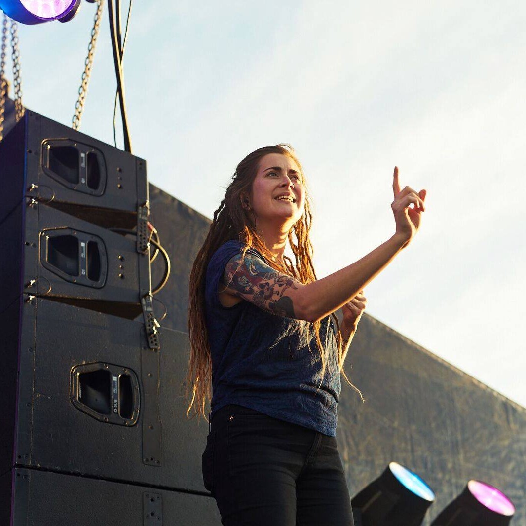 A Auslan intepretor in action on a stage.