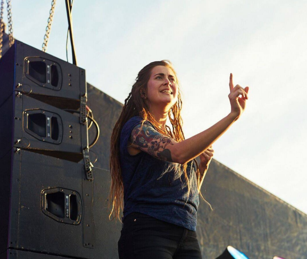 A Auslan intepretor in action on a stage.