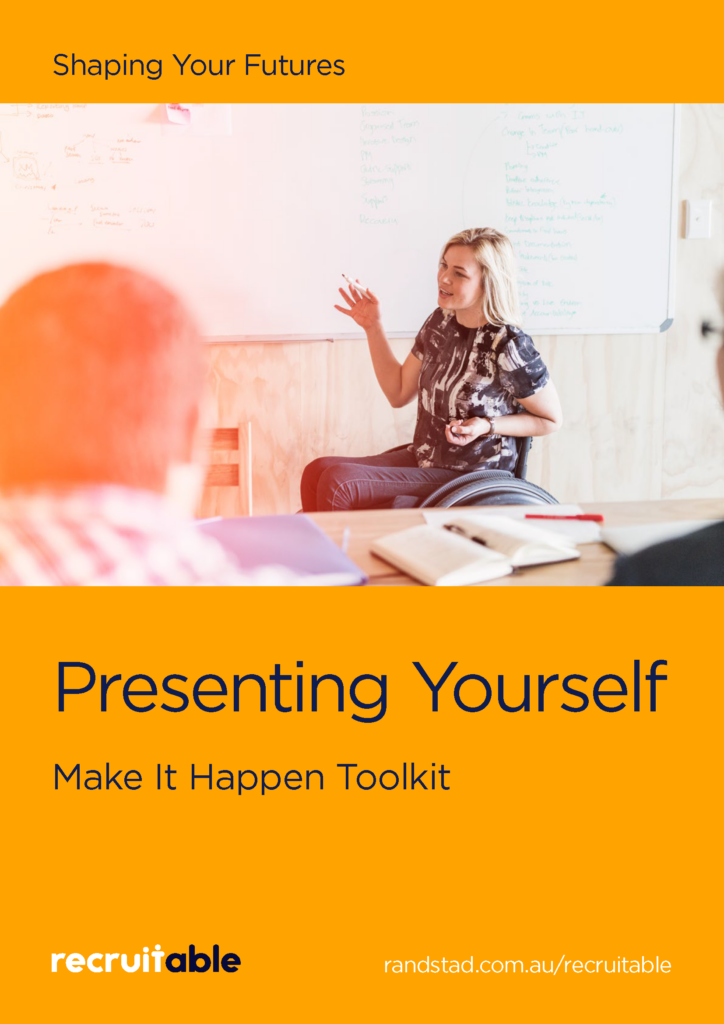 The image has a red background with the heading "Shaping your futures" in dark blue text at the top. Below the heading, there is an image of a woman sitting in a wheelchair, presenting to a class. She is holding a marker and speaking to an audience. Behind her is a board with writing on it. In front of her is a table with some books. Below the image, large bold text reads, "Presenting Yourself" and "Make it Happen Toolkit." At the bottom of the image, the Recruitable logo is displayed, along with the URL: https://www.randstad.com.au/recruitable/.