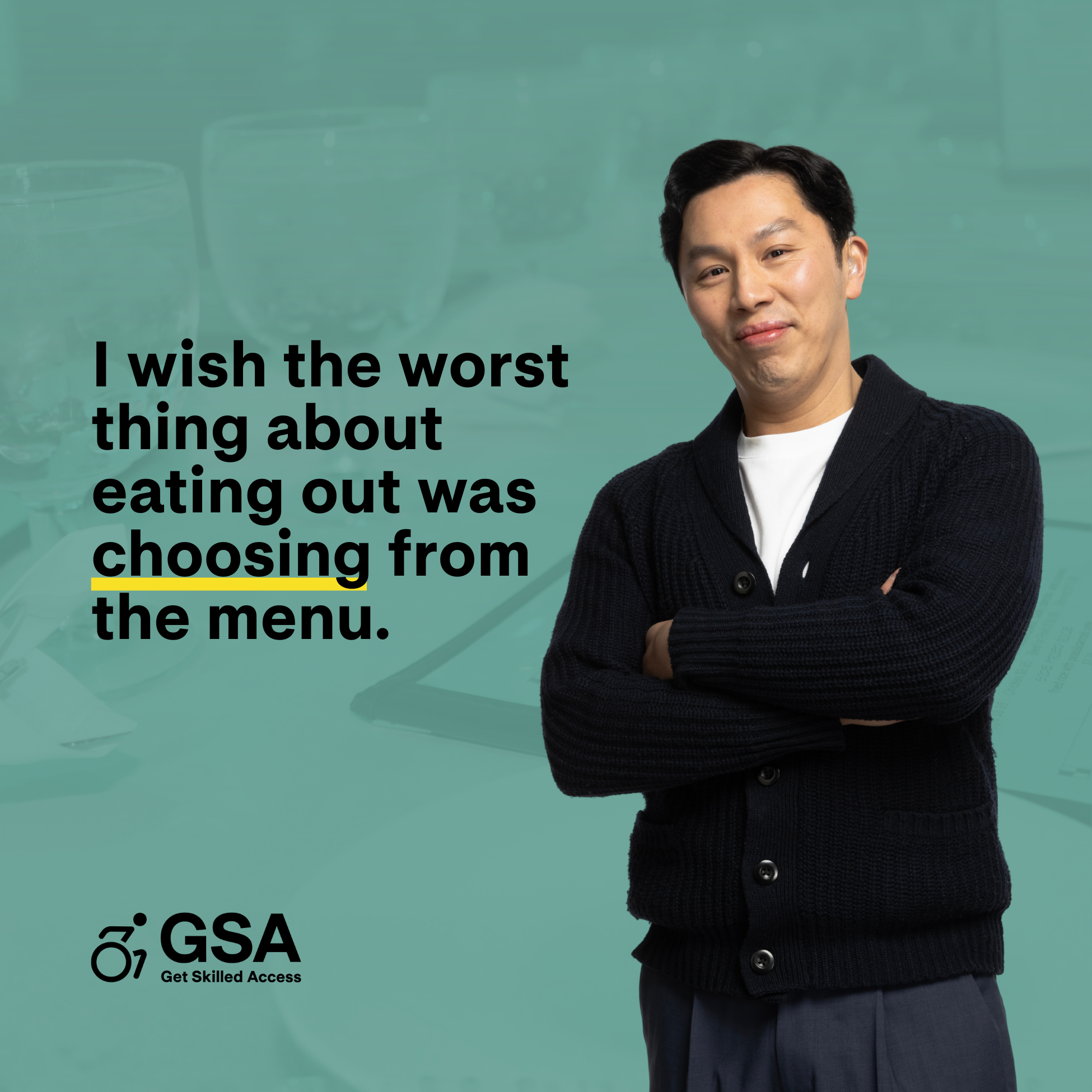 A man stands with his arms crossed, smiling slightly at the camera against a green background with blurred table settings. To his left, text reads, “I wish the worst thing about eating out was choosing from the menu.” The GSA – Get Skilled Access logo appears at the bottom.