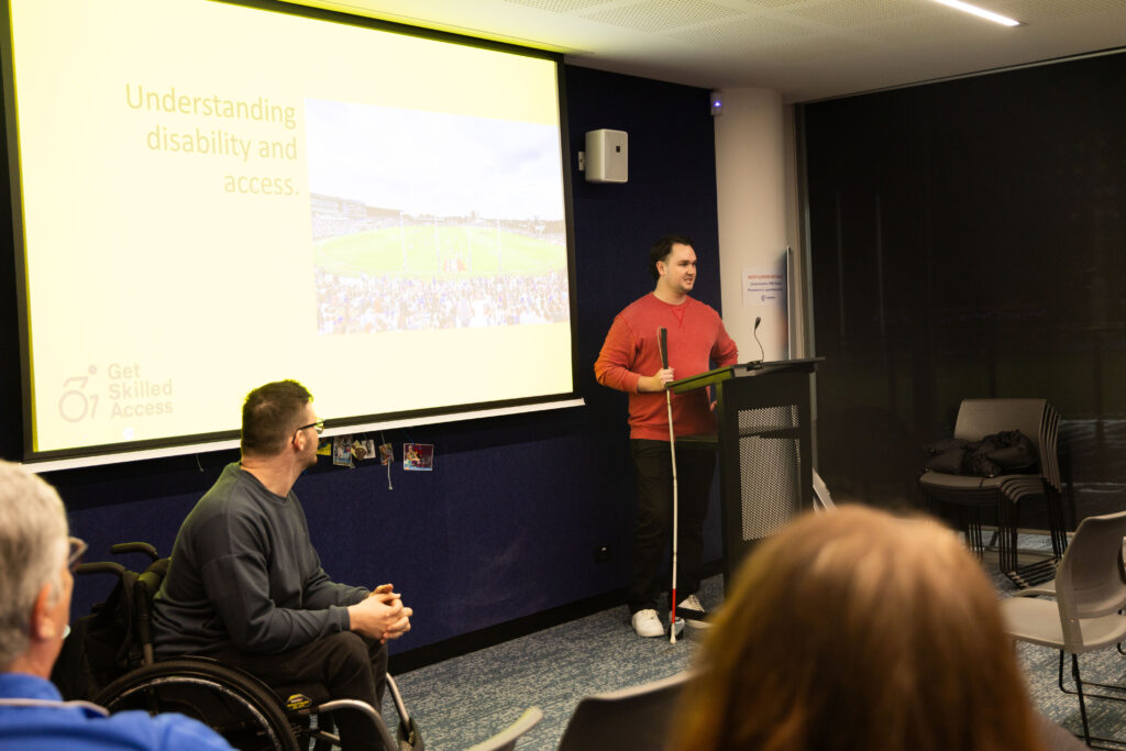 GSA team at a training session with yellow GSA slide on the background